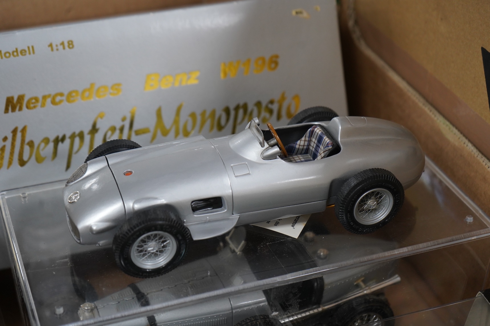 A collection of diecast vehicles, including a boxed CMC 1:18 scale Mercedes Benz W196 1950s single seat racing car, together with five boxed early Matchbox Models of Yesteryear, two Atlas Dinkies, a 1:18 scale Bburago Bu